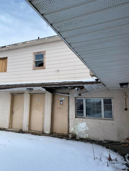Exterior of the Crest Motel, prior to renovation.