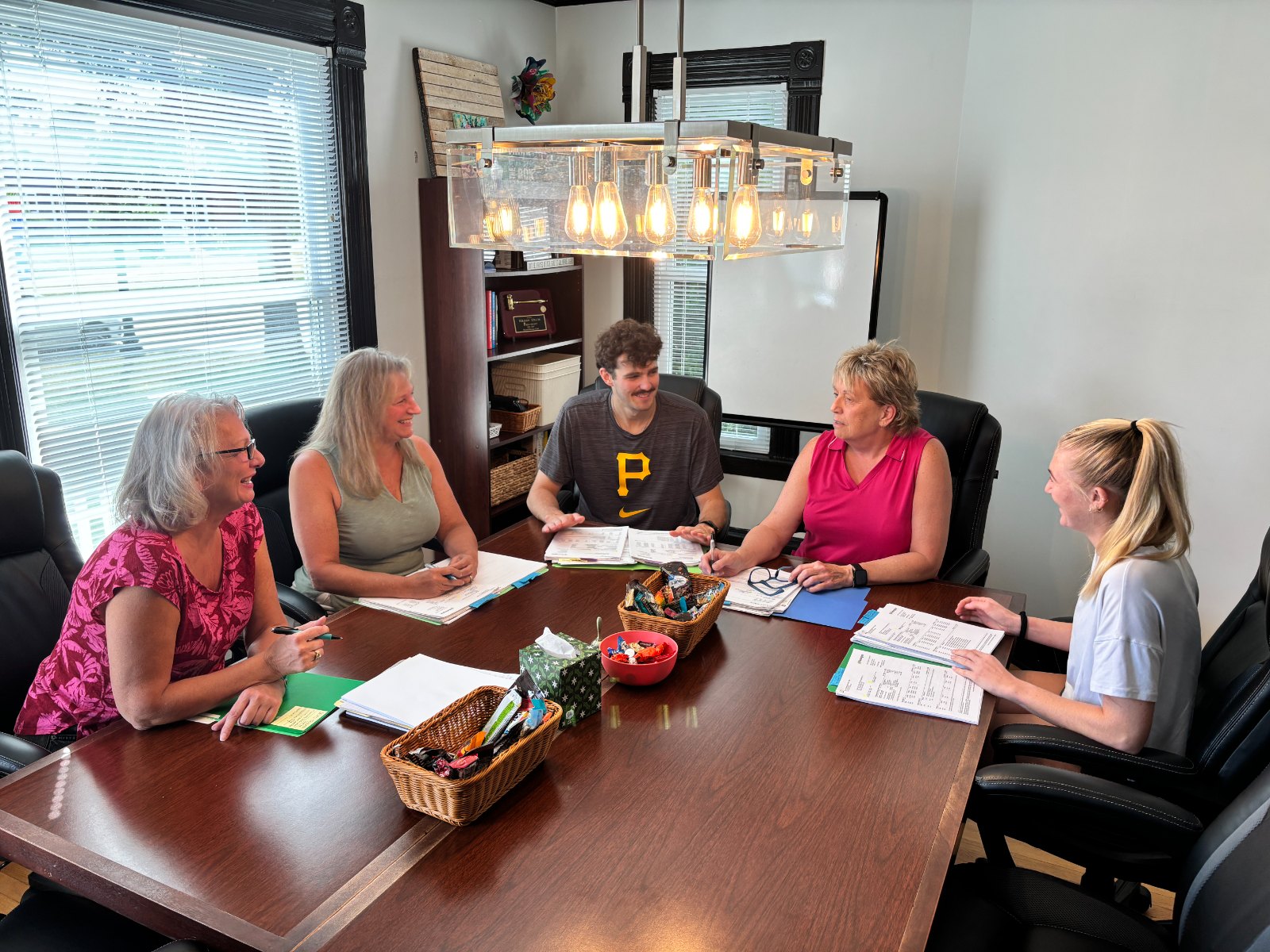 The Community Catalysts team around the conference table at the Howell office