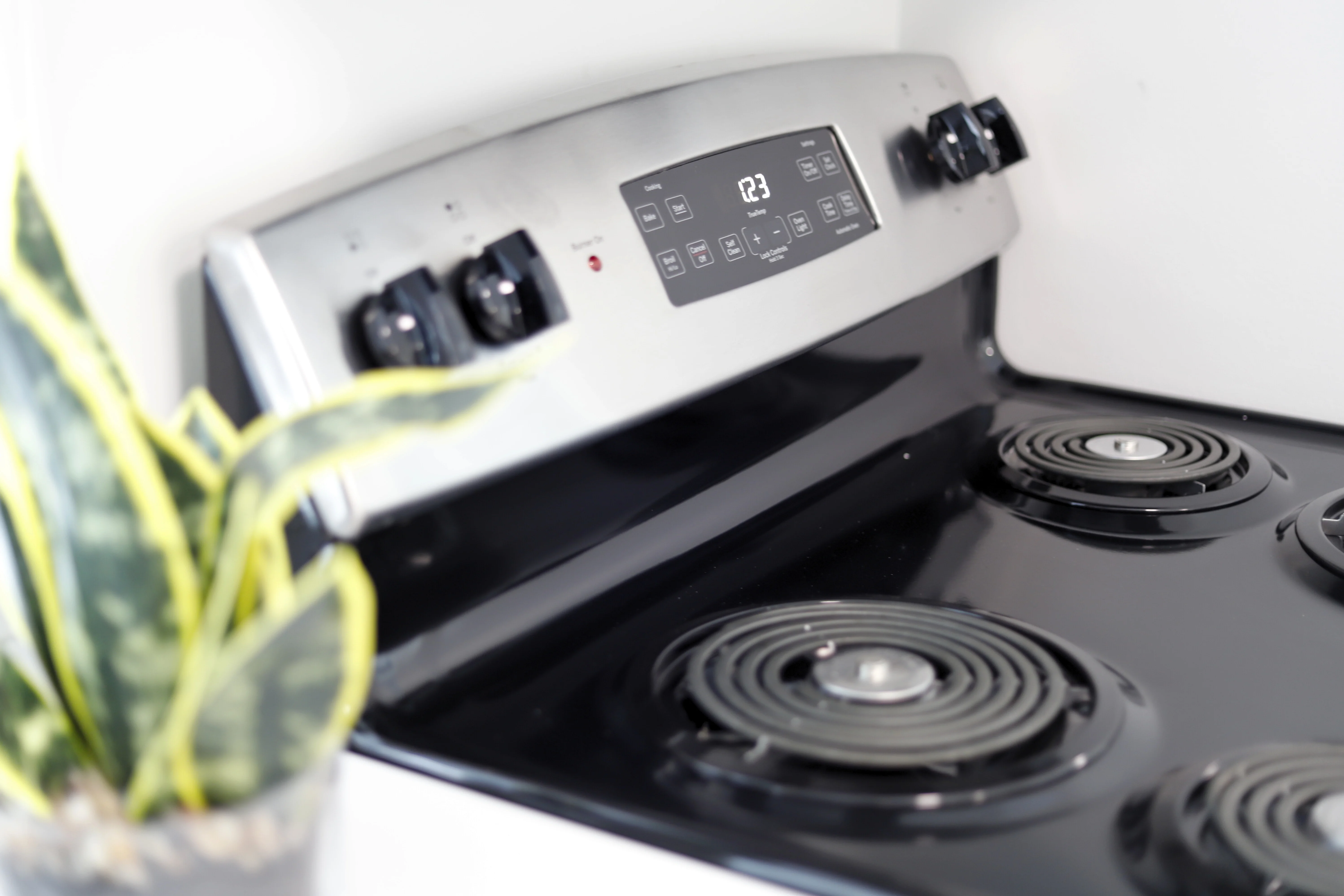 A full range and cooktop in a furnished unit