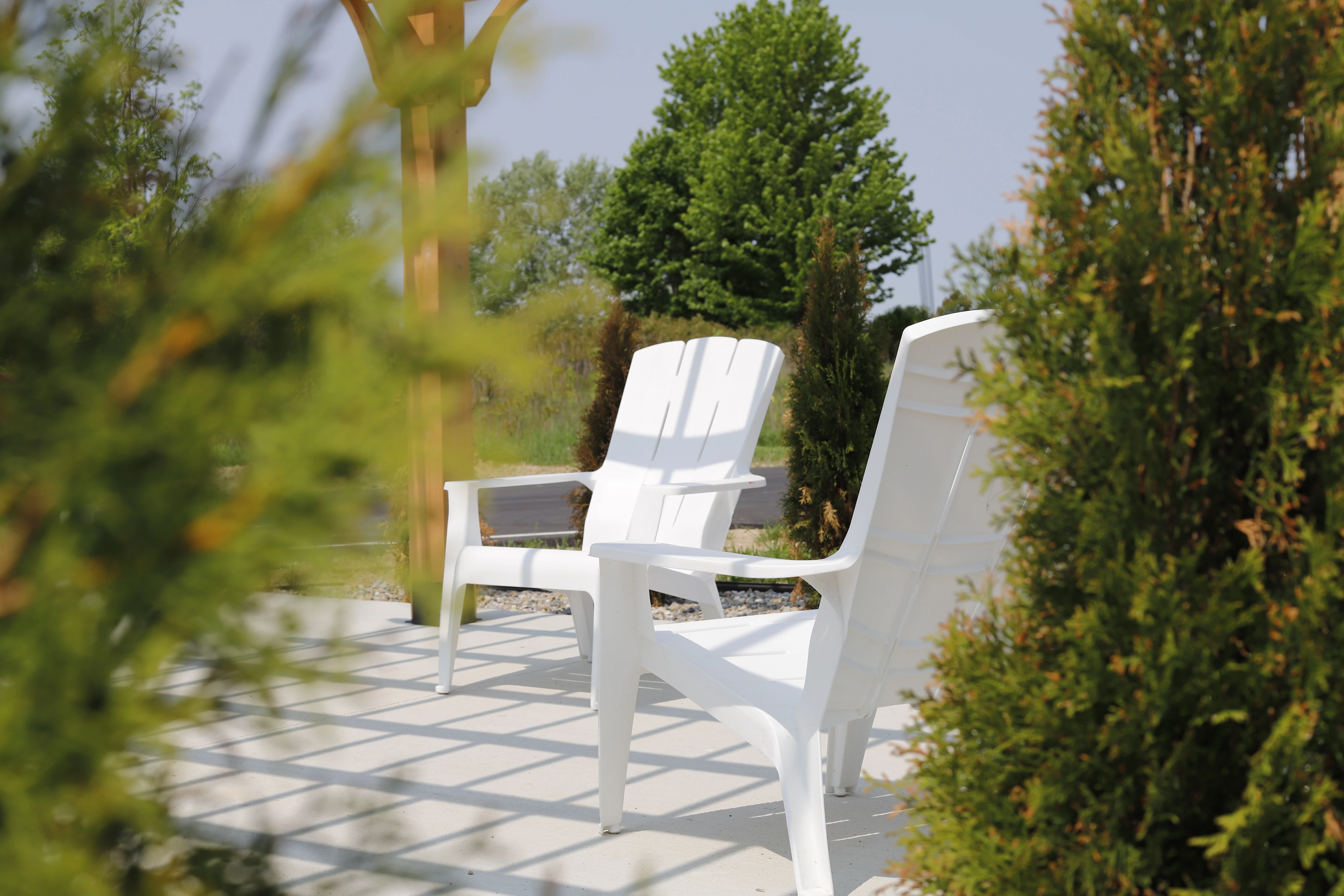 Adirondack chairs tucked among new landscaping