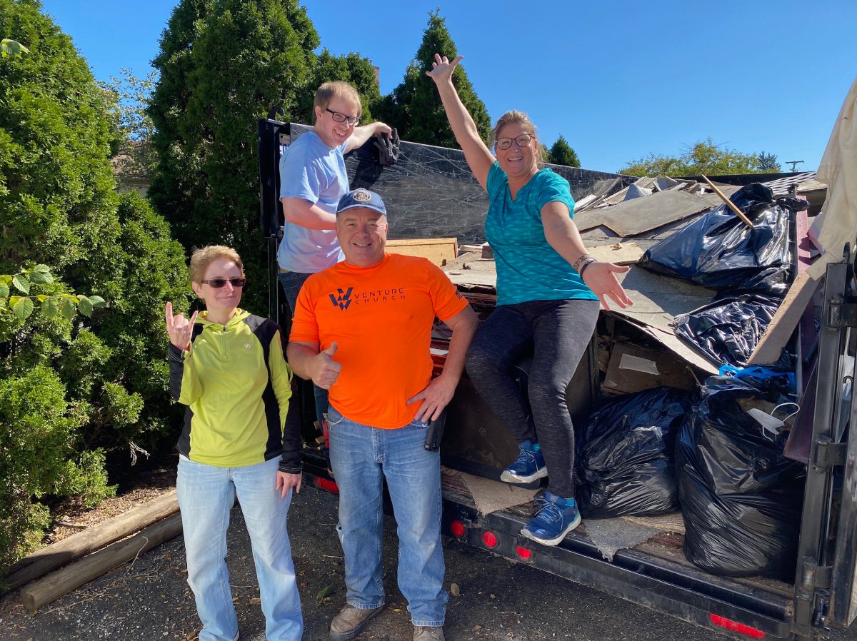 Volunteers celebrating a neighborhood cleanup day