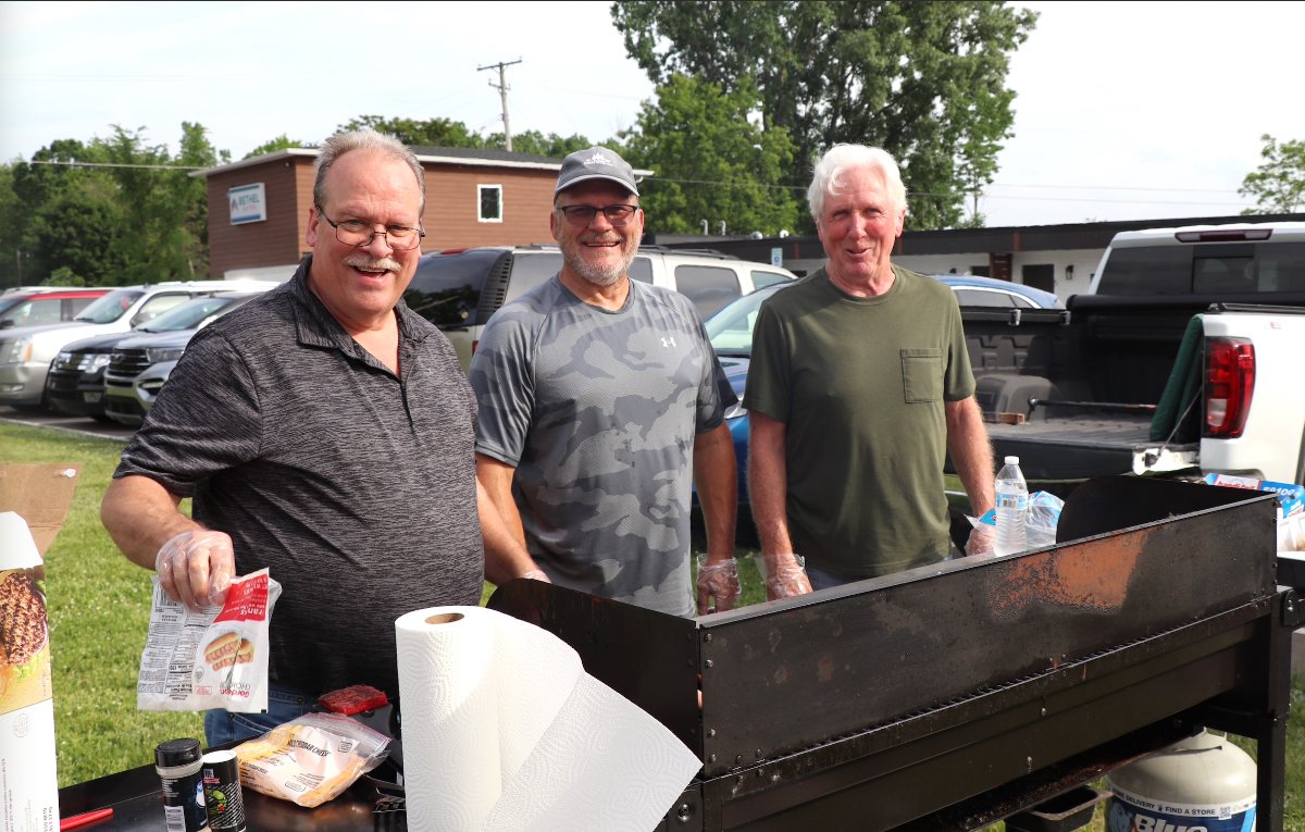 Volunteers grilling at a community cookout